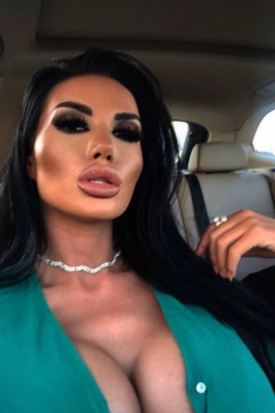 Selfie of brunette escort called Cece in a car 
